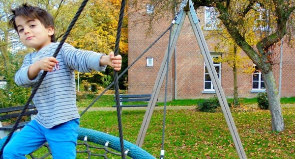 A boy plays in the playground of an asylum seeking centre in Baexem in the Netherlands. — courtesy UNICEF/Sidra