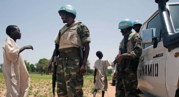 UN News' Abdelmonem Makki and his nephews in the village where he was raised in South Darfur, Sudan. — courtesy UN News/Abdelmonem Makki