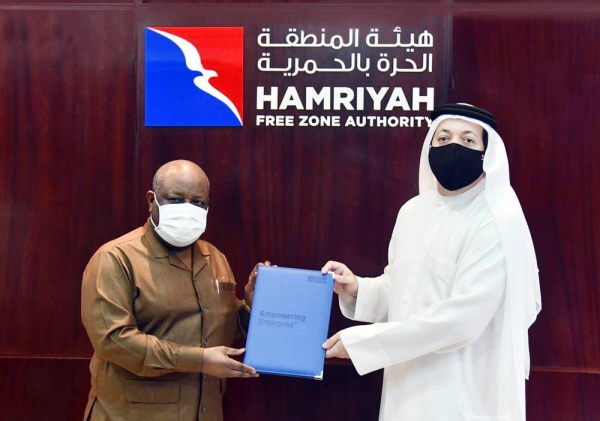 Saud Salim Al Mazrouei, director of Hamriyah Free Zone Authority, and Antonio Joao Pinto, the founder, and CEO of Global Vision Specialty Chemicals & Proud Lubricants and Grease IND sign a deal to invest in the free zone.