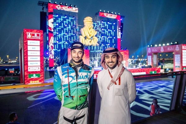 Al Ghunaim posing with the Minister of Sports Prince Abdulaziz Bin Turki on Saturday prior to the start of the Dakar Rally.