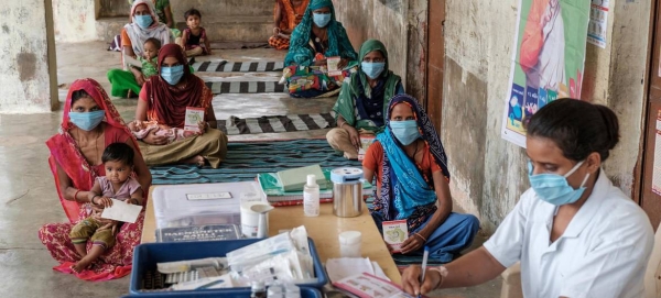 Families receive vaccinations and counseling at a socially distanced Village Health and Nutrition Day in Gujarat, India, in this file picture. — Courtesy photo