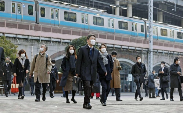 Commuters head to work from Shimbashi Station in Tokyo on Thursday morning. — courtesy Kyodo