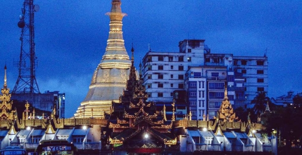 A pagoda at dawn in downtown Yangon, the commercial hub of Myanmar. — courtesy Unsplash/Kyle Petzer