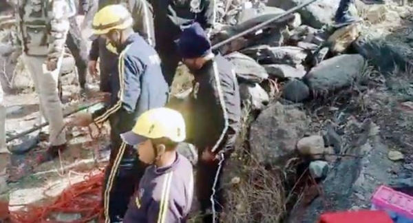 TV grab shows rescue workers look at the flood-ravaged area following  a massive avalanche and resultant flooding in the north Indian state of Uttarakhand’s Chamoli Saturday.