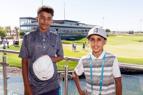 Nasser Altorki, 14, and Khalid Almodaimeegh, 10, with their souvenirs (courtesy Golf Saudi).