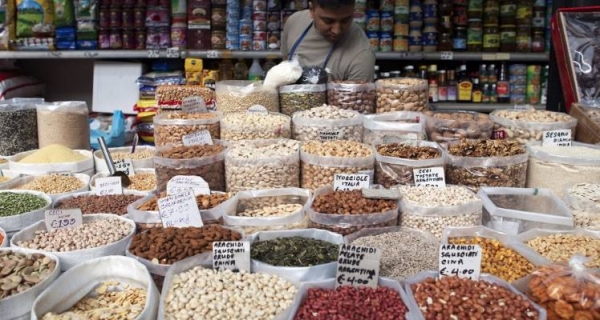 
Pulses and dried fruits for sale at a market in Rome. — courtesy FAO/Marco Salustro