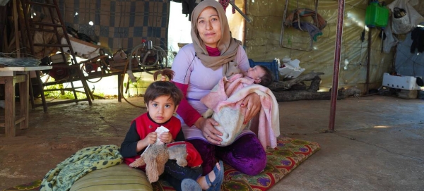 A family in Syria receives food assistance from the World Food Programme. — Courtesy photo
