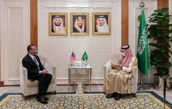 Saudi Arabia’s Energy Minister Prince Abdulaziz Bin Salman, left, met here on Thursday with Malaysian Foreign Minister Hishammuddin Hussein. — SPA photos