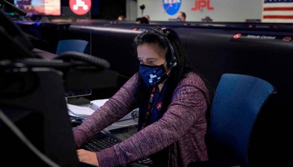 In this handout image provided by NASA, Perseverance Mars rover mission commentator and guidance, navigation, and controls operations Lead Swati Mohan studies data on monitors in mission control at NASA's Jet Propulsion Laboratory in Pasadena, California, on Thursday. — Courtesy photo