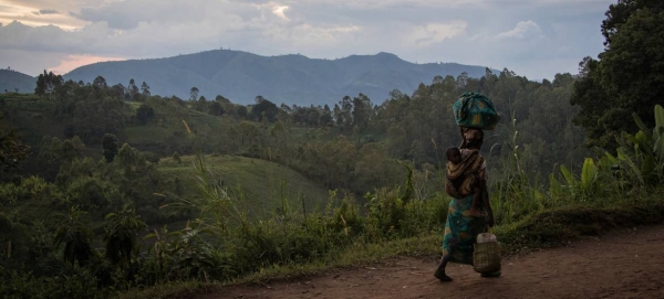 A woman, carrying her child, walks back to her home from the fields in D.R. Congo’s restive North Kivu province in this courtesy file photo.