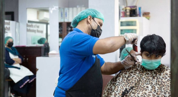 Facemasks are worn at a hair salon in Karachi, Pakistan. — courtesy IMF/Saiyna Bashir