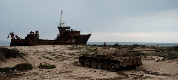 The rusting hulk of a ship and a destroyed armored vehicle on the beach in Zuwarah, western Libya, is seen in this file courtesy photo.