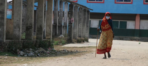 A 69-year-old woman walks in a village in Nepal in this courtesy file photo. Older women, in particular, face additional challenges and prejudice due to ageist attitudes and discrimination.
