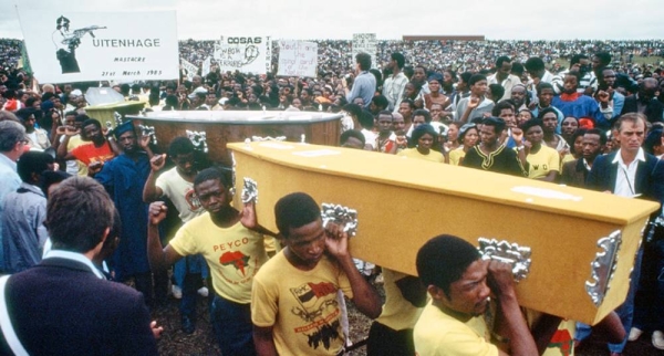 Mourners carry coffins of those who were killed by the South African police on International Day for the Elimination of Racial Discrimination in 1985 at Langa Township in Uitenhage. — courtesy UN Photo