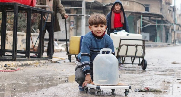 Young boys collect water from UNICEF-supported a water point in east Aleppo City in Syria. — courtesy UNICEF/Khuder Al-Issa