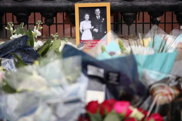 Floral tributes are left outside Buckingham Palace following news of Prince Philip's death. — courtesy PA