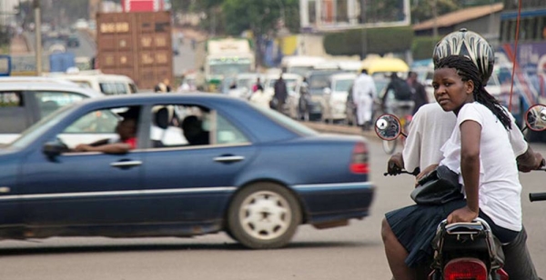A Boda-Boda driver and passenger wait for the traffic light at the Jinja Road Junction in Kampala, Uganda. — courtesy World Bank/Sarah Farhat

© Sarah Farhat/The World Bank