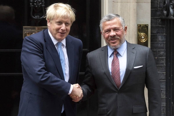 British Prime Minister Boris Johnson left, has expressed his country’s full support for Jordan's security and stability under the leadership of King Abdullah II in a phone call on Tuesday. — Courtesy file photo