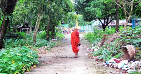 A monk walks toward a pagoda temple near Yangon, Myanmar. —Unsplash/Anika Mikkelson