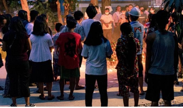 File photo shows people holding a vigil in Yangon, Myanmar. — courtesy Unsplash/Zinko Hein
