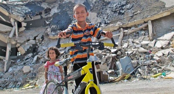 File photo shows children playing near the ruins of Bab al-Azizia in Tripoli, Libya. — courtesy UNICEF/Asif Abodeed