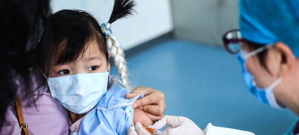 A 3-year-old girl receives a vaccine shot at a community health center in Beijing, China, in this courtesy file photo. 