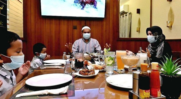 An Indonesian family breaking fast during Iftar in Ramadan.