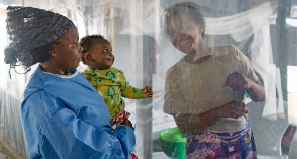 
File photo shows a plastic sheet separating a mother from her son at an Ebola treatment center in Beni, North Kivu province, Democratic Republic of the Congo. — courtesy UNICEF/Thomas Nybo