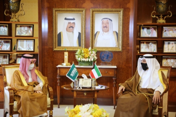 Saudi Arabia’s Foreign Minister Prince Faisal Bin Farhan, left, is seen with his Kuwaiti counterpart, Sheikh Ahmed Nasser Al-Muhammad Al-Sabah, in this file photo.