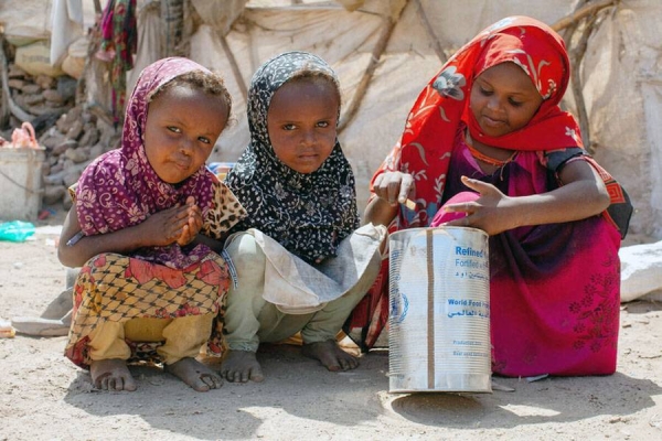 Karima, 7, Bagdhad, 4, Fatooma, 3, play with a WFP oil container. The children and their mother fled to Mokha alone. She said at the time she was so hungry that she ate an onion she found on the ground.