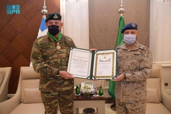 Al-Ruwaili decorates his Greek counterpart with King Abdulaziz medal