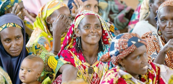 Women attend a community meeting in Cameroon. — courtesy UN Women/Ryan Brown