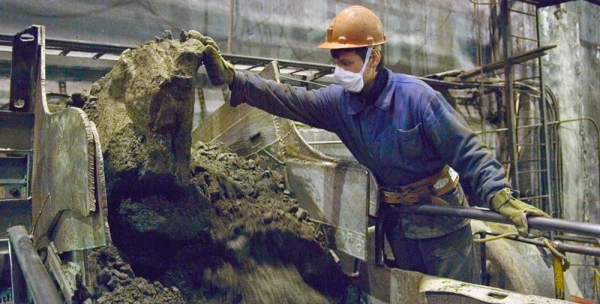 A miner at work at a mineral extraction site in Murmansk, Russia. — courtesy ILO/Marcel Crozet