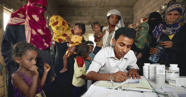 A medical worker registers patients in a village in Yemen. — courtesy UNOCHA/Giles Clarke