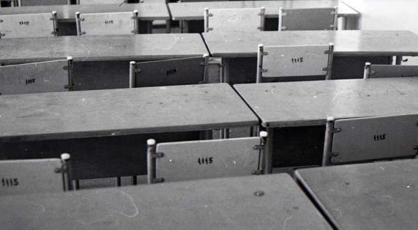 School desks and chairs in a classroom. (file) — courtesy Unsplash/ David Shoykhet