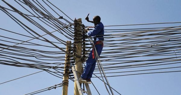 A technician works on electricity cables in Mogadishu, Somalia. — courtesy UN Photo/Ilyas Ahmed