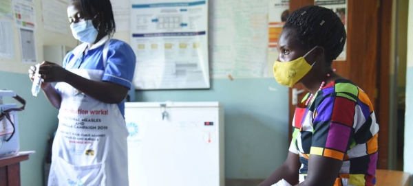 A nurse prepares to administer a COVID-19 vaccination to a patient at a health centre in Kabale, Uganda. — Courtesy photo