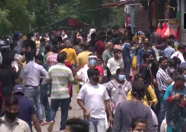 People throng markets in Sarojini Nagar in the national capital after lockdown restrictions were eased.