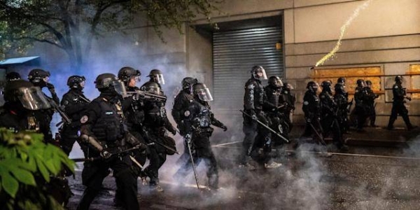 About 50 officers assigned to the Portland police department's crowd control team resigned one day after one of the team's officers was indicted for allegedly using his department-issued baton to assault a protester last summer. — Courtesy file photo