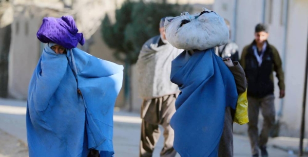 Women carry bundles through a neighborhood of Kabul, the capital of Afghanistan. — courtesy World Bank/Ghullam Abbas Farzami