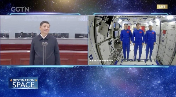Chinese President Xi Jinping (L) talks to the three Chinese astronauts in space via video link, on Wednesday. — courtesy CGTN Screenshot