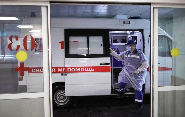 An ambulance crew arrives at a temporary medical facility established for COVID-19 patients at Moscow City Clinical Hospital No 15. Russia reported its highest daily death toll since December with 619 people reported dead due to COVID-19 as the country is hit hard by the Delta variant.