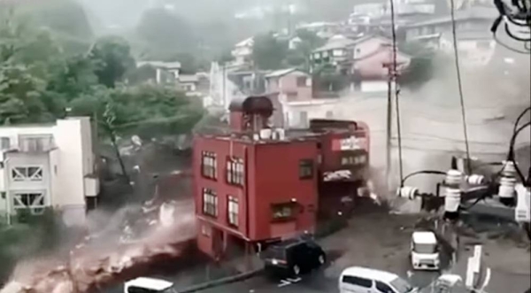 Black water mixed with soil and sand flowing rapidly from the top of a mountain at about 10:30 a.m. in Atami, Shizuoka Prefecture. — courtesy Twitter