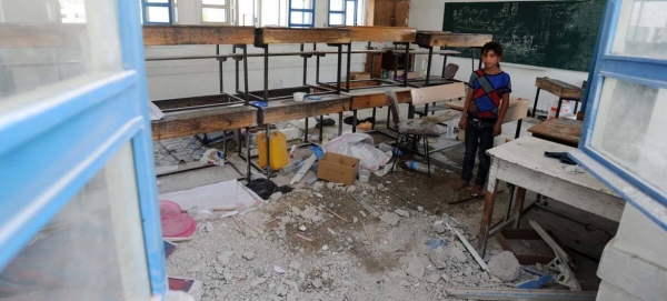 A Palestinian student inspects the damage at a UN school in Gaza. — Courtesy file photo