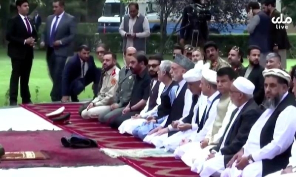 Images shown on national broadcaster Tolo TV showed Ghani and the group calmly continuing their prayers at the outdoor palace gathering as security guards rushed from the crowd. — Courtesy photo
