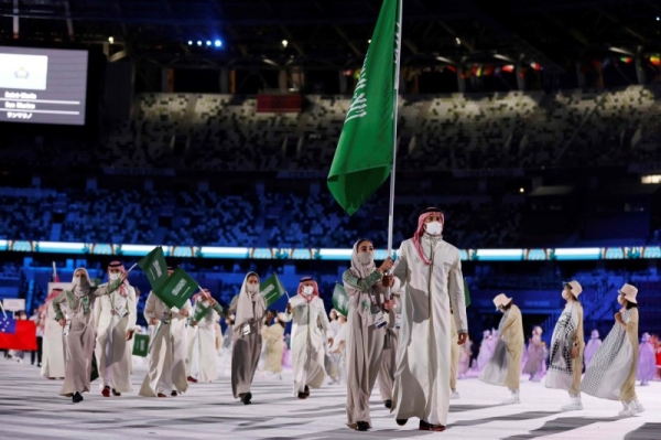 Saudi rower Hussein Alireza and the Saudi female sprinter Yasmine Al-Dabbagh carried Saudi Arabia’s flag at the opening ceremony of the Olympic Games Tokyo 2020 on Friday.