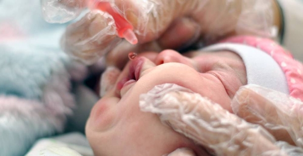 An infant is vaccinated in a medical center in Hama, in Syria, against a range of diseases including hepatitis. — courtesy UNICEF/Faour