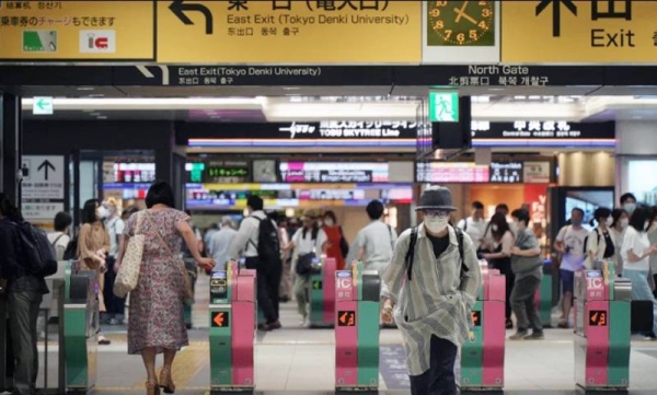 

Passengers pass through the gates of a subway station in Tokyo. A man stabbed ten passengers with a knife on a Tokyo subway on Friday and was arrested by police after fleeing, a railway official and news reports said.