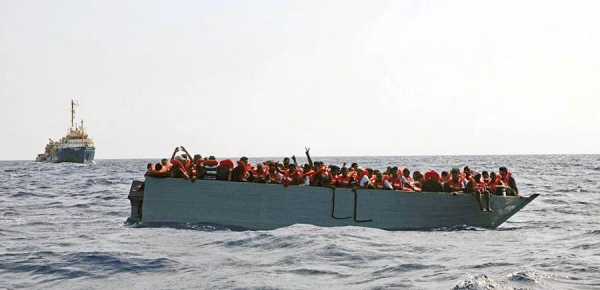 In this photo taken on Aug. 2, 2021 a boat overcrowded with migrants is waiting to be rescued by Sea Watch 3 in the Mediterranean Sea. — courtesy Sea-Watch