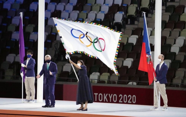 Paris mayor Anne Hidalgo waves the Olympic flag during the closing ceremony of the Tokyo Olympics Sunday. Hidalgo was joined by Tokyo governor Yuriko Koike and IOC President Thomas Bach for the flag handover ceremony. — courtesy Twitter